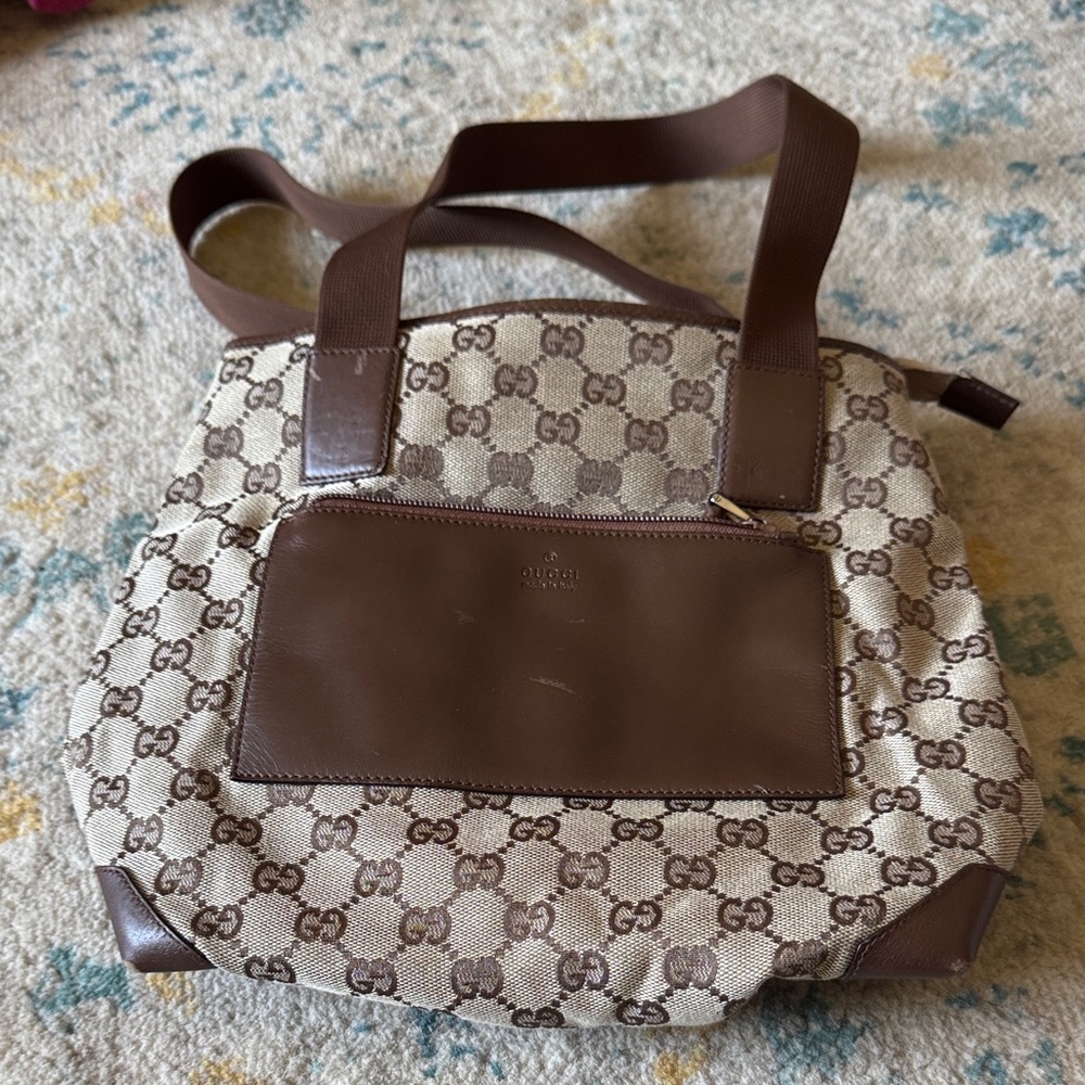 Authentic Gucci Beige and Brown GG Canvas Shoulder bag.